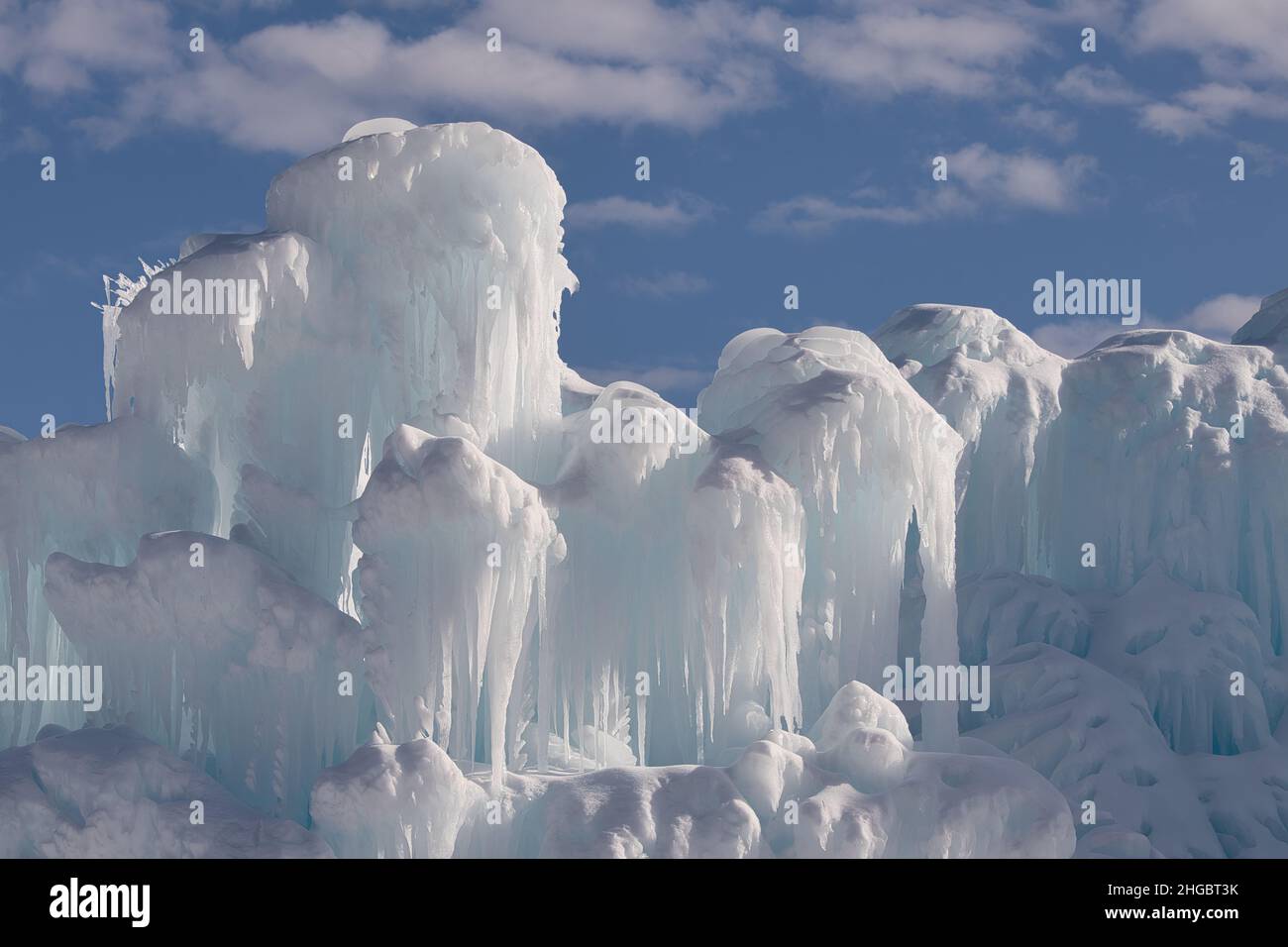 Beautiful ice structure in winter with blue sky and puffy clouds Stock ...