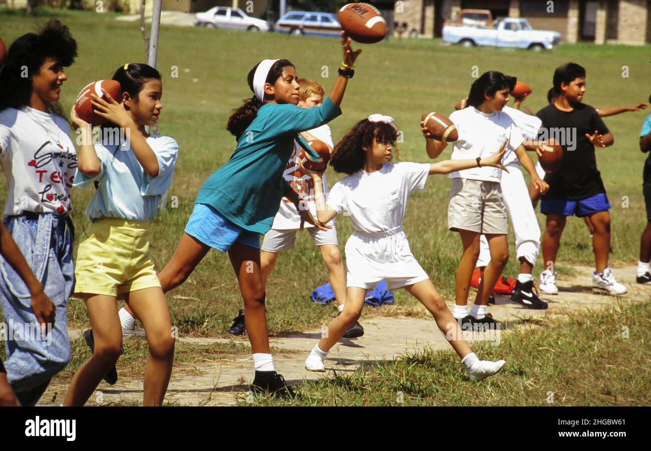 austin-texas-usa-1992-junior-high-students-practice-throwing-a-football