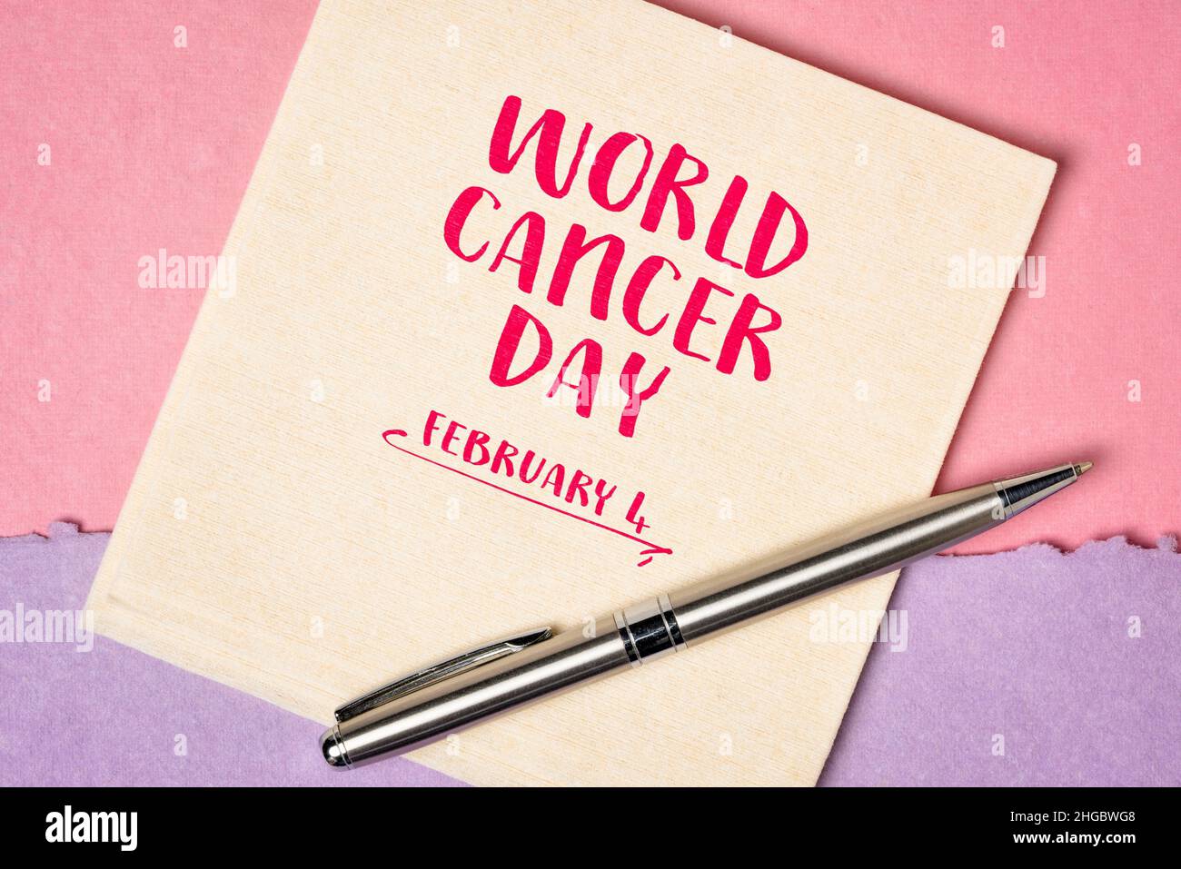 World Cancer Day, February 4 - handwriting on napkin, annual event to raise awareness of cancer, its prevention, detection, and treatment Stock Photo