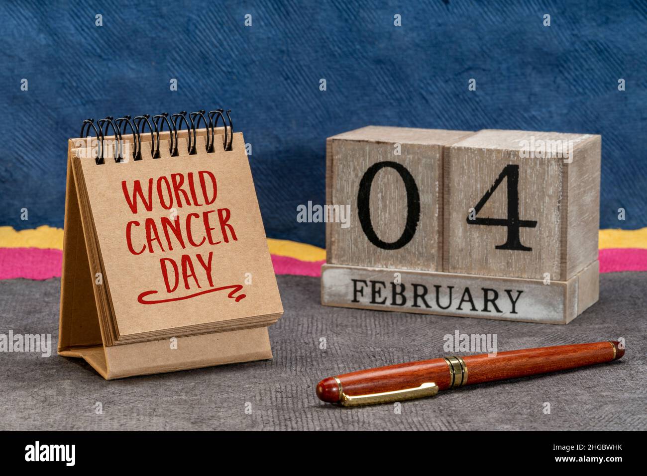 World Cancer Day, February 4 - handwriting and wooden block calendar, event to raise awareness of cancer, its prevention, detection, and treatment Stock Photo