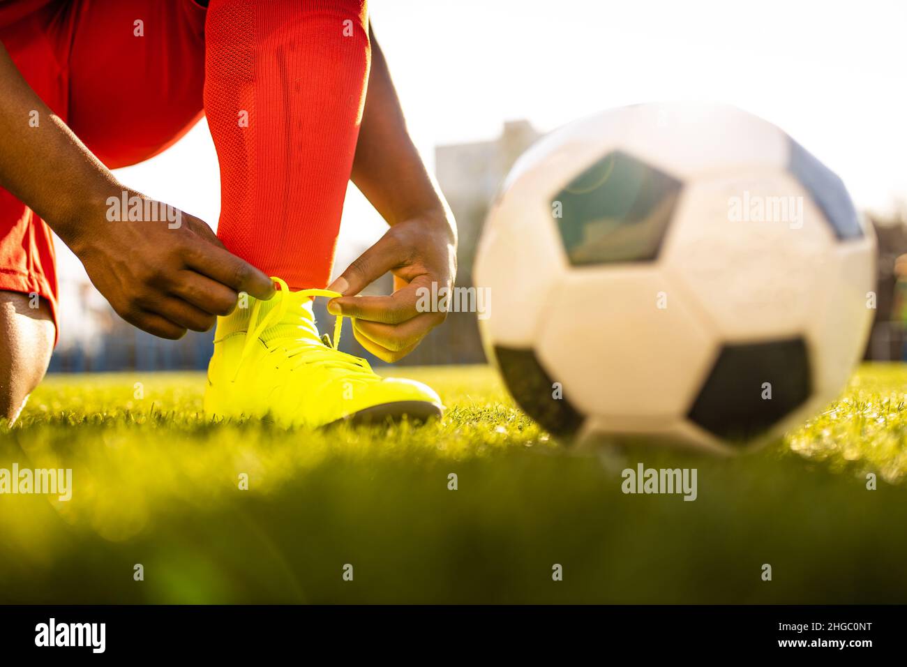 authentic happy football trainer working out outdoor in summer great day Stock Photo