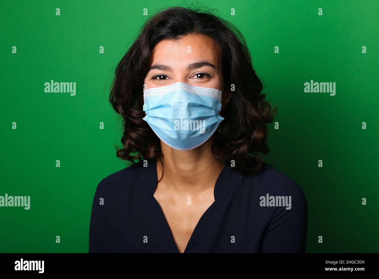 Beautiful woman wearing a mouth mask Stock Photo - Alamy