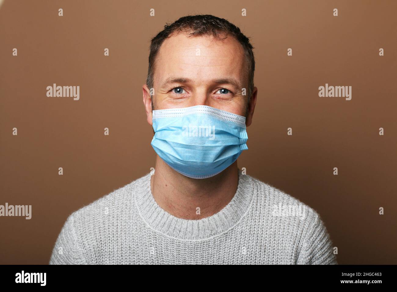 Beautiful man wearing a mouth mask Stock Photo Alamy