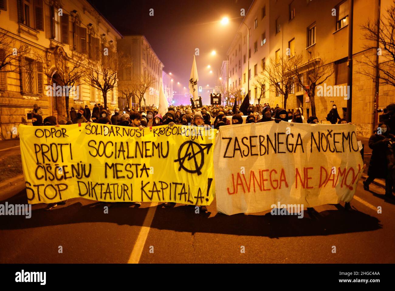 Ljubljana, Slovenia. 19th Jan, 2022. Protesters march through the streets while holding banners during the demonstration. On the first anniversary of the controversial evictions of artists and cultural centers from a squatted old Rog bicycle factory in Ljubljana protesters again protested against the increasing privatization and commercialization of public space, and social cleansing of the city that is pushing citizens, especially those with low income, out. Credit: SOPA Images Limited/Alamy Live News Stock Photo