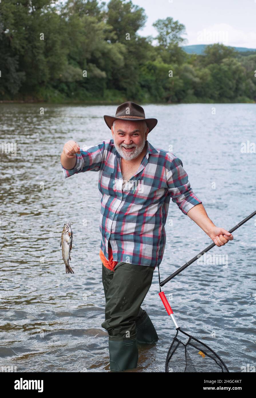 Brown trout being caught in fishing net. Trout. Lure fishing. Fishing