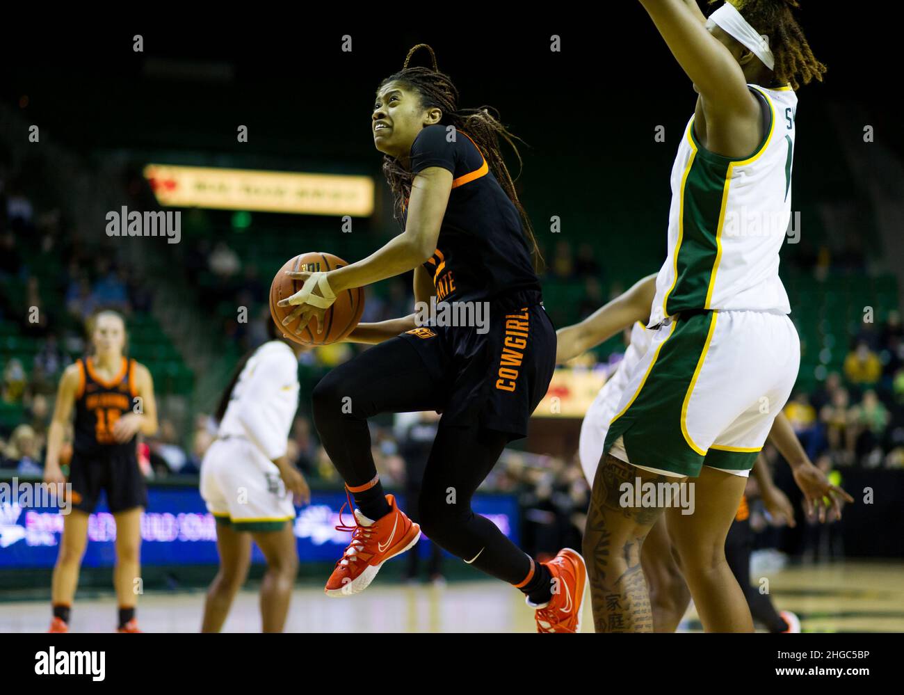 Waco, Texas, USA. 19th Jan, 2022. Oklahoma State Cowgirls guard N'Yah Boyd (11) shoots the ball during the 2nd quarter of the NCAA Basketball game between the Oklahoma State Cowgirls and Baylor Lady Bears at Ferrell Center in Waco, Texas. Matthew Lynch/CSM/Alamy Live News Stock Photo