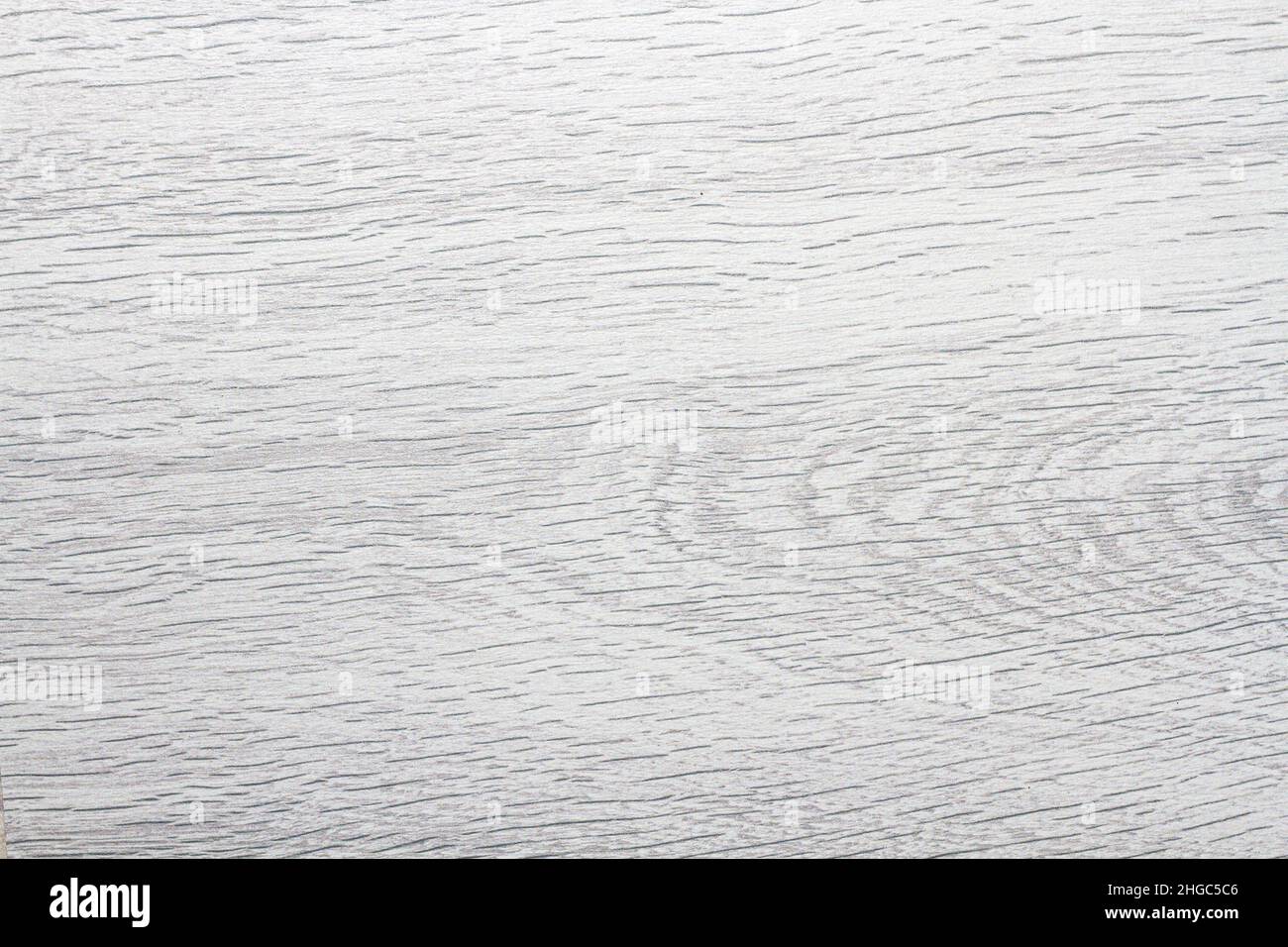 Wood texture. Wooden board close up. The cracks are deep. Laminate flooring. Tree rings in a cut