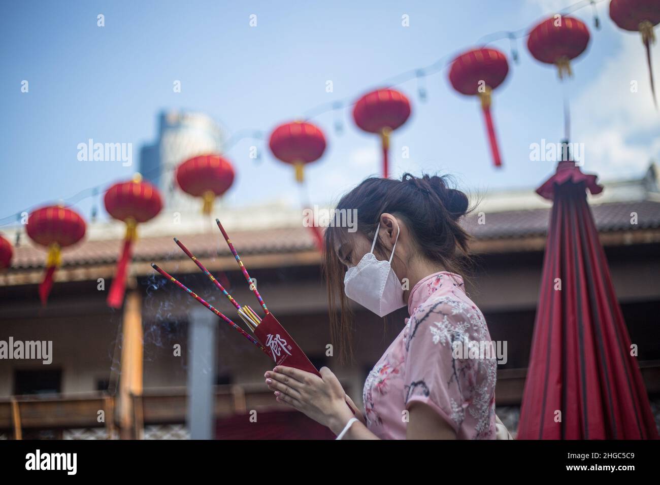 Bangkok, Thailand. 19th Jan, 2022. A woman praying before Chinese New
