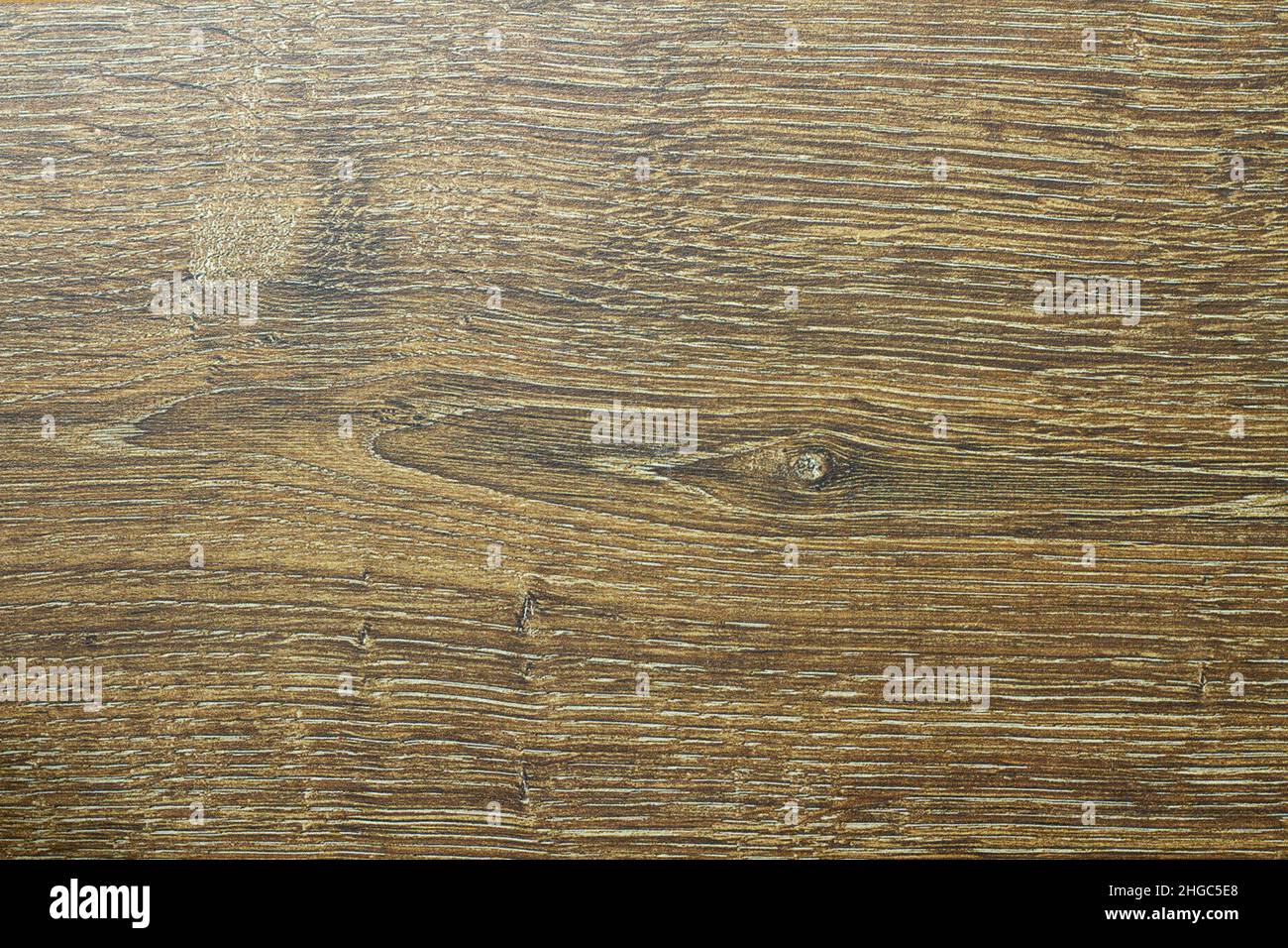 Wood texture. Wooden board close up. The cracks are deep. Laminate flooring. Tree rings in a cut