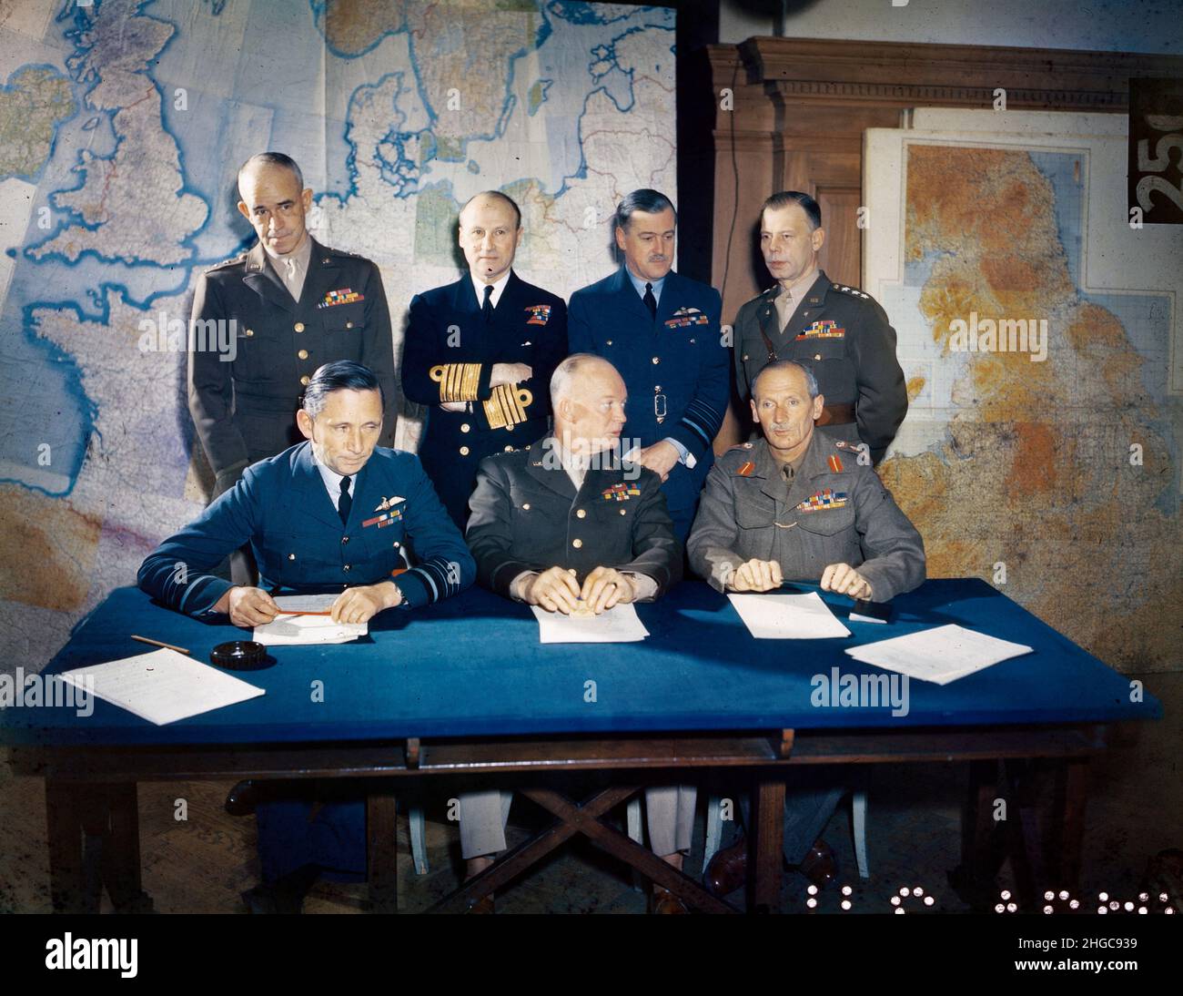 General Dwight D. Eisenhower with his Supreme Command staff.  Left to right, seated: Air Chief Marshall Sir Arthur Tedder, General Eisenhower and General Sir Bernard Montgomery.  Left to right, standing: Lieutenant General Omar Bradley, Admiral Sir Bertram Ramsey, Air Chief Marshal Sir Trafford Leigh Mallory and Lieutenant General W. Bedell Smith. Stock Photo