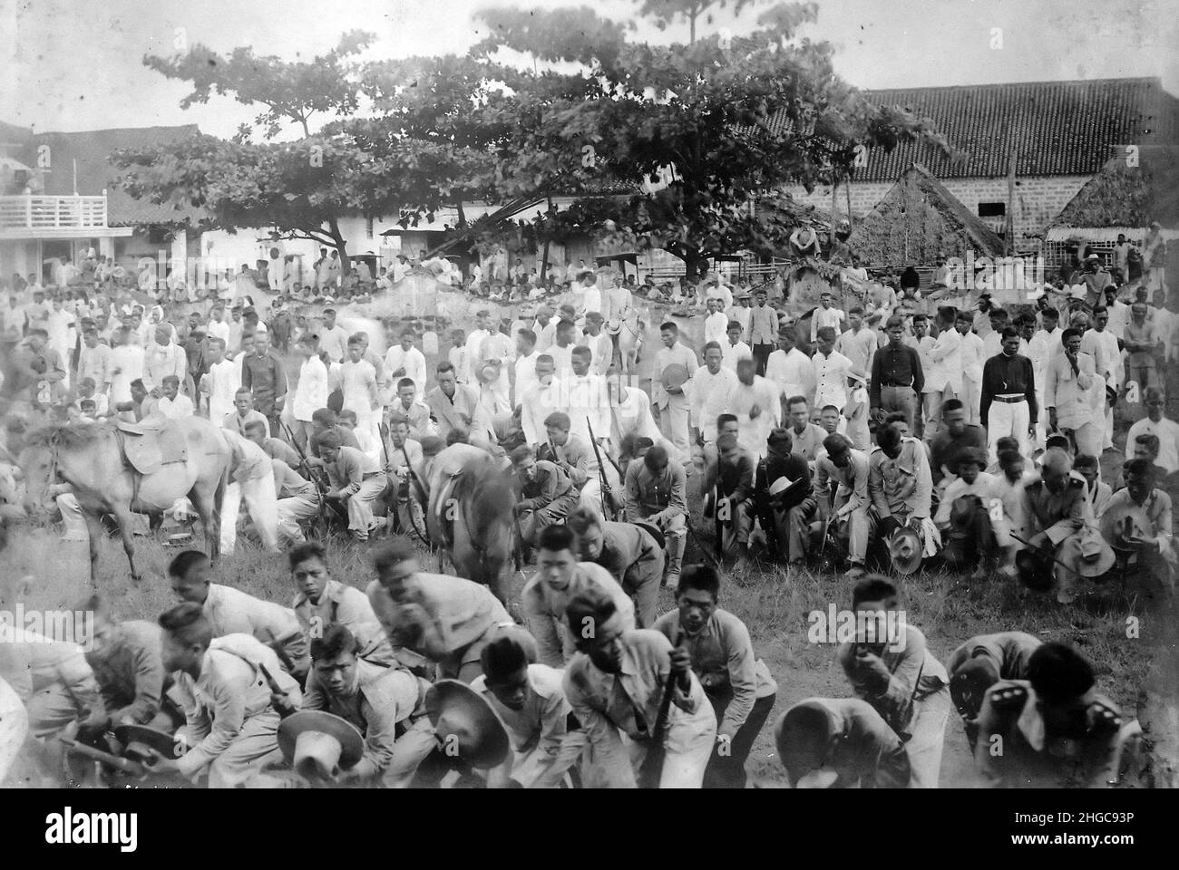 Fiipino soldiers laying down their weapons in surrender during the Filipino-American war which lasted from 1899 to 1902 Stock Photo