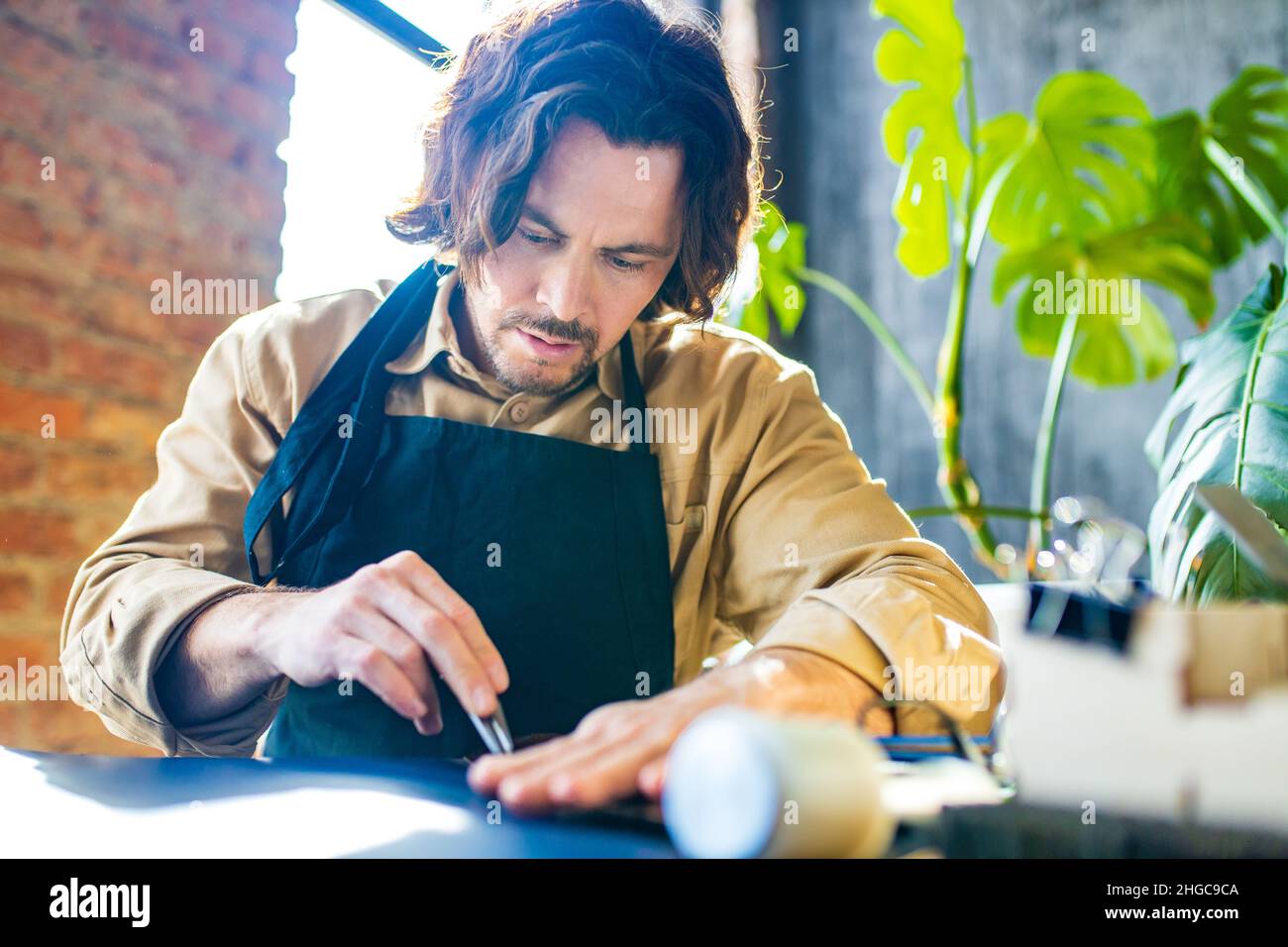 creating process of the leather things in the handmade workshop Stock ...