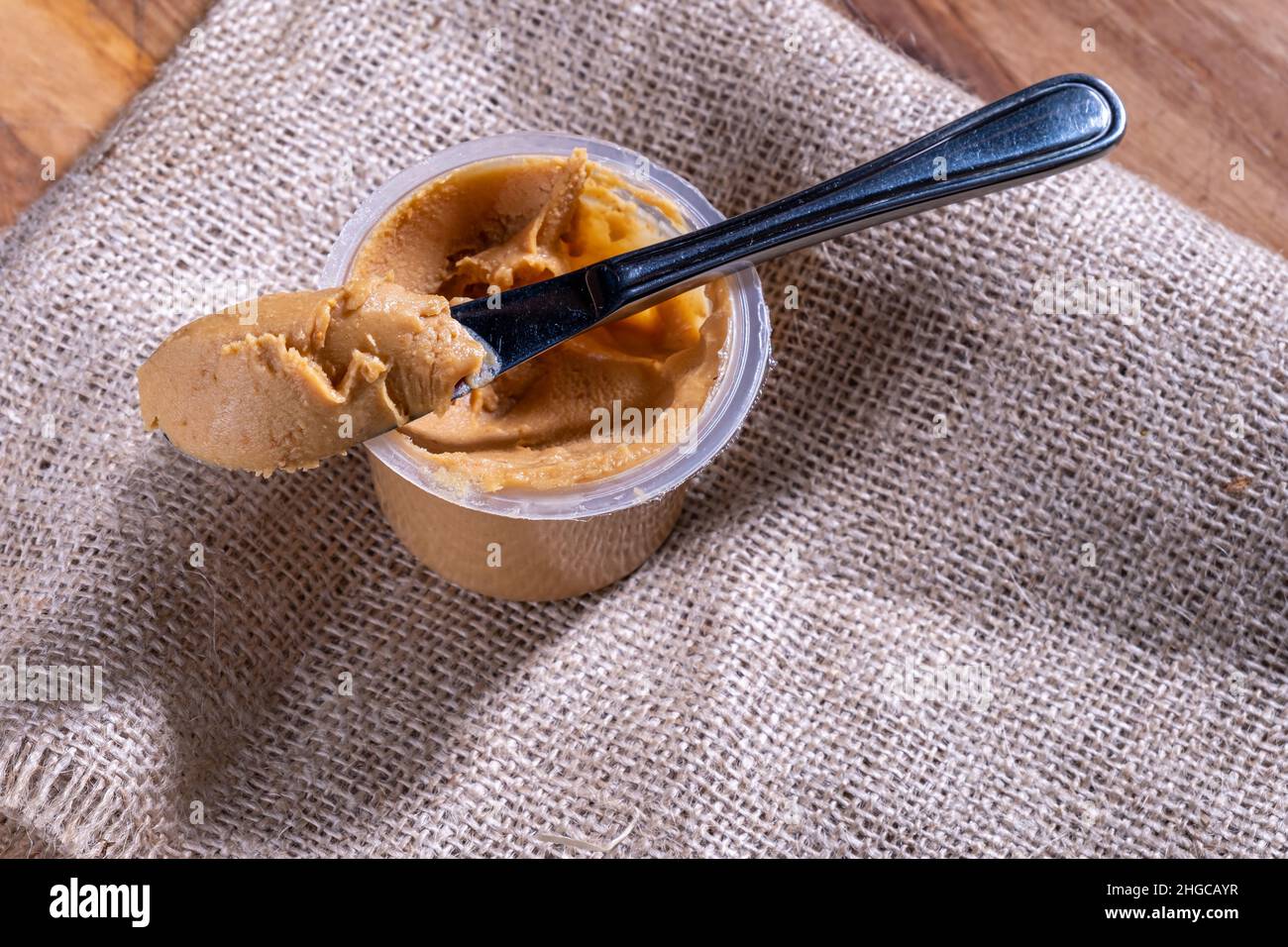 peanut butter, with a knife, natural background Stock Photo Alamy