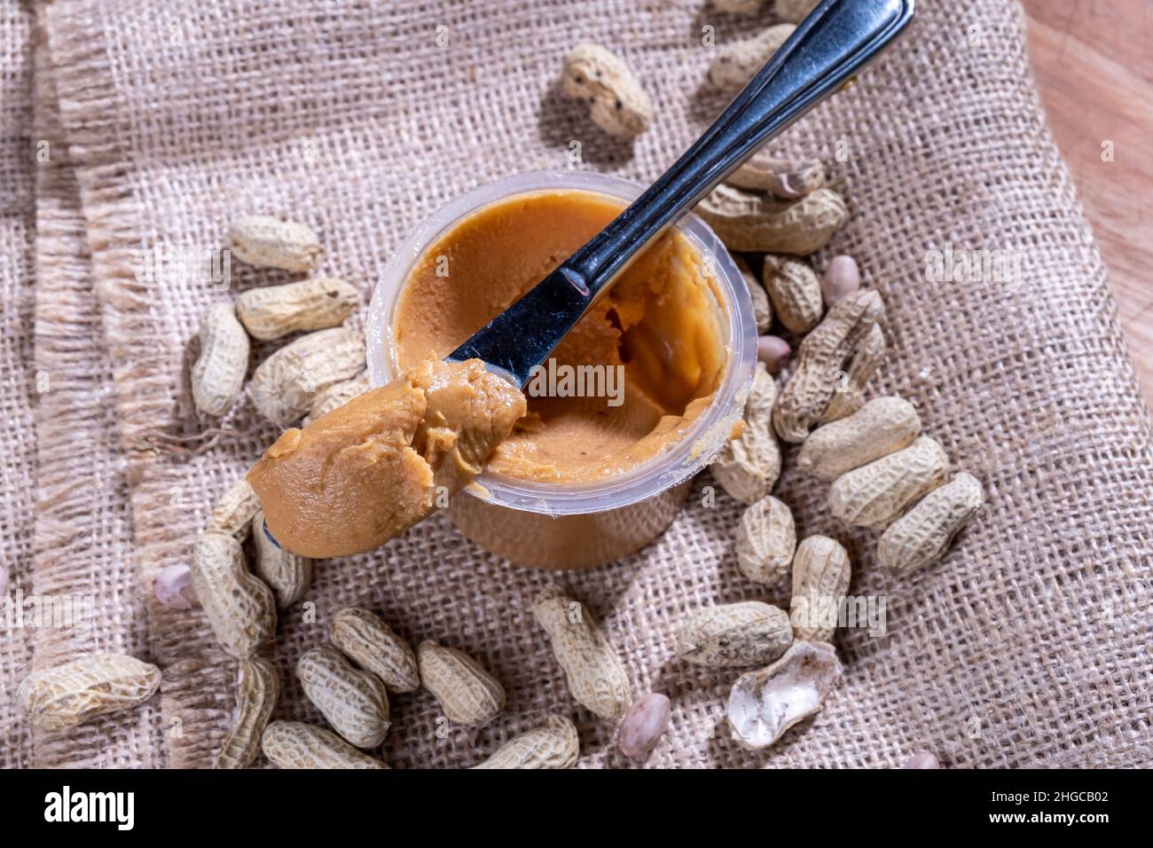 peanut butter, with a knife, natural background Stock Photo Alamy