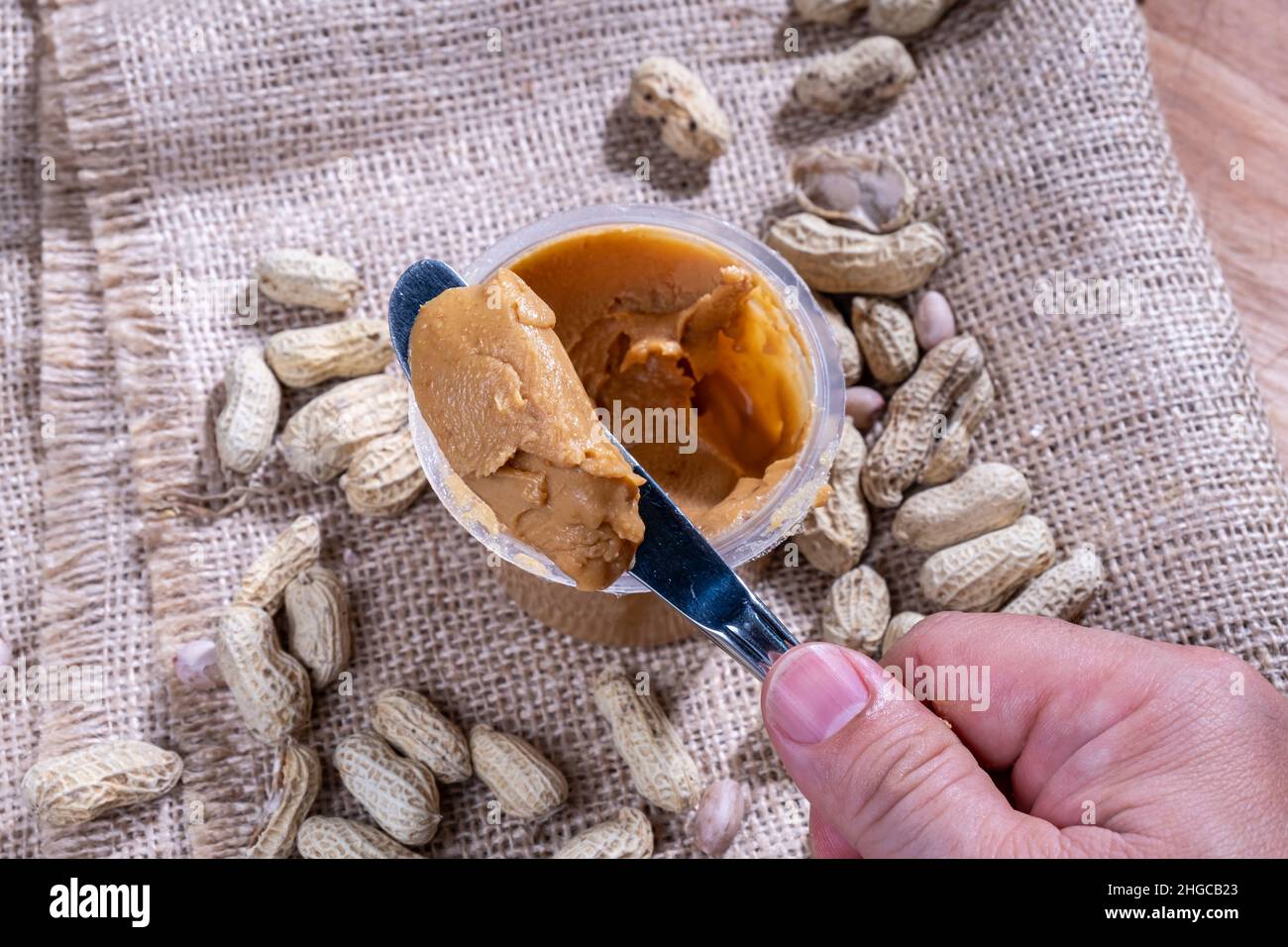 peanut butter, with a knife, natural background Stock Photo Alamy