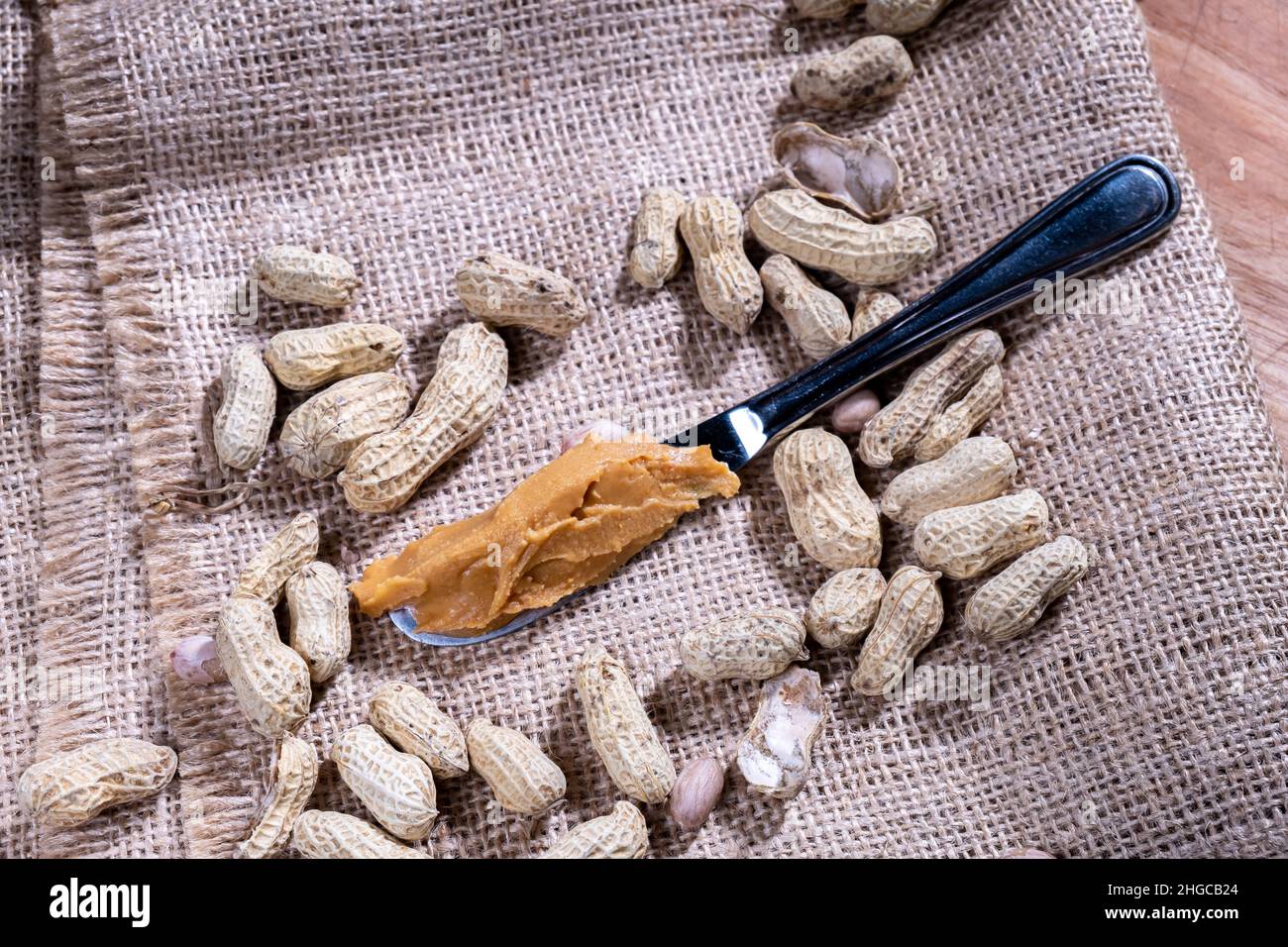 peanut butter, with a knife, natural background Stock Photo Alamy