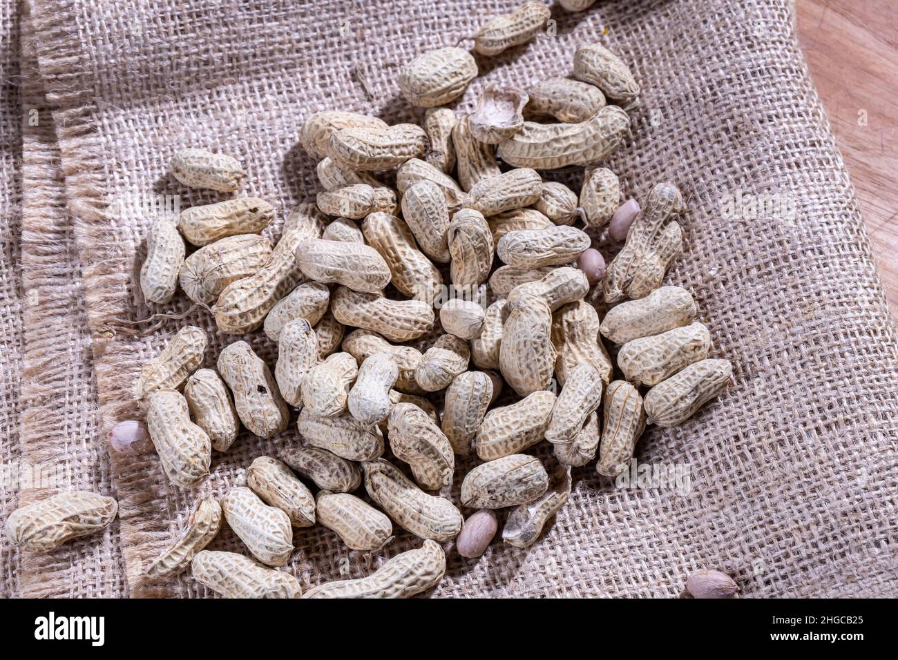 Peanut shell is cooked, with skin on. The peanut, also known as the groundnut, goober, pindar or monkey nut, and classified as Arachis hypogaea. Stock Photo