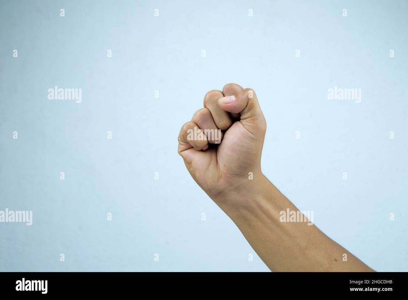 Man's hand gesturing isolated on a white background. Stock Photo