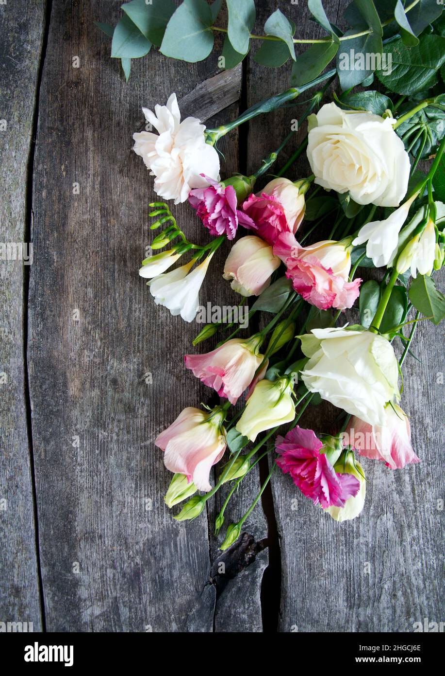 bouquet of beautiful flowers on wooden surface Stock Photo