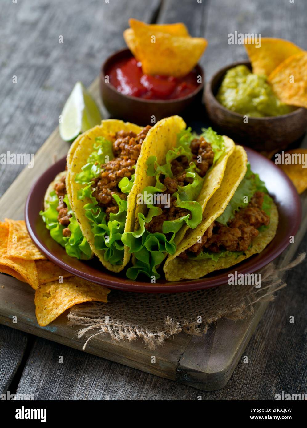 plate of tacos, nachos and tomato dip Stock Photo - Alamy