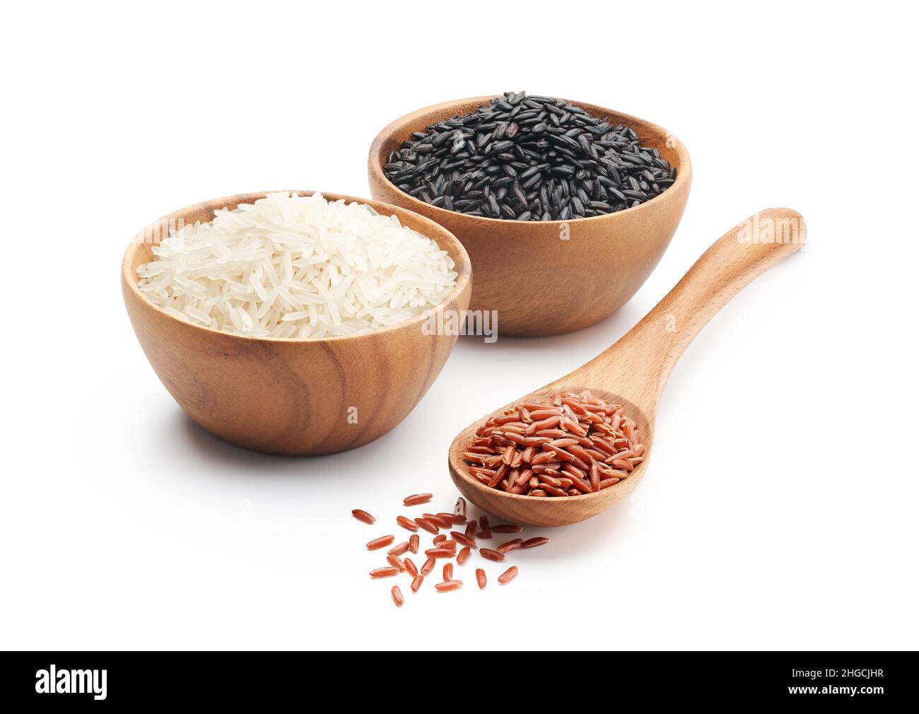 Organic red rice, basmati rice and black wild rice isolated on white
