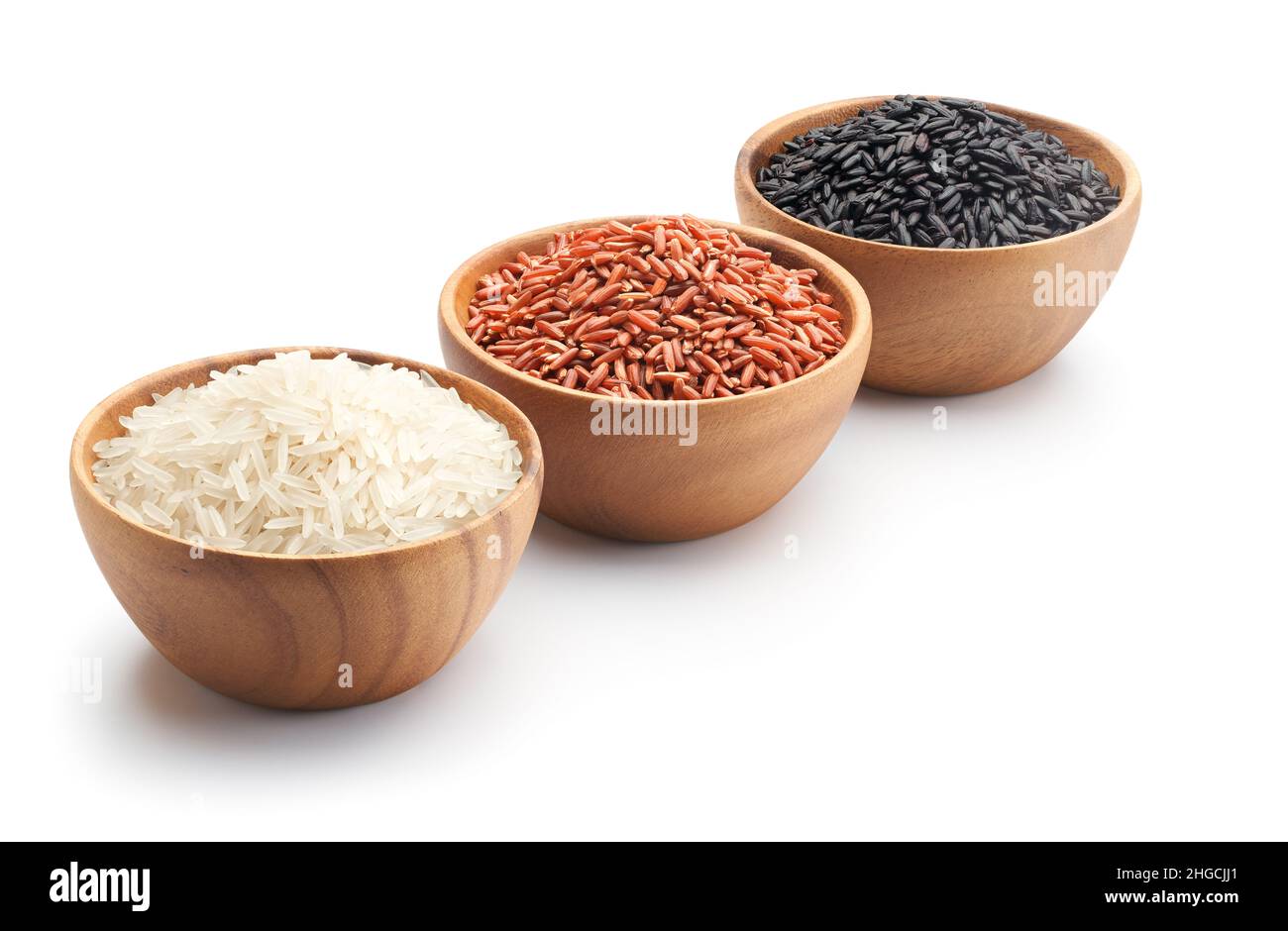 Three types of rice in bowls - basmati rice, red rice and black rice - clipping path included Stock Photo