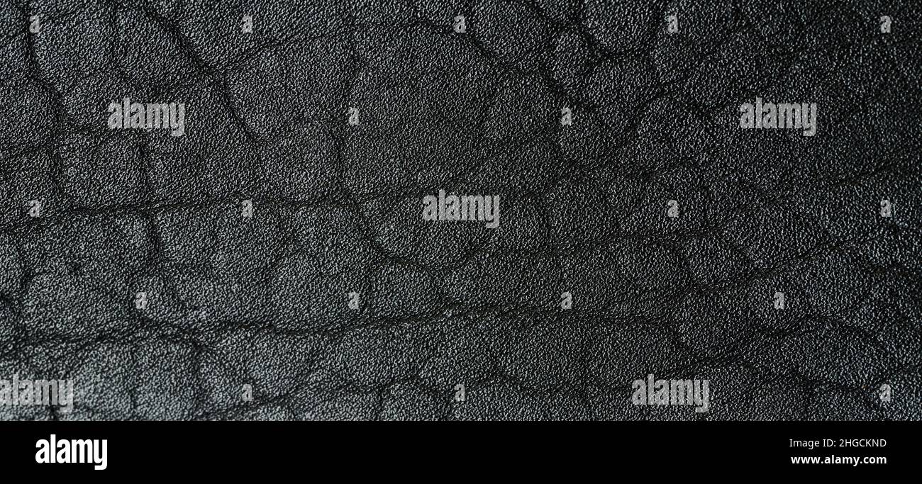 Rough black leather surface macro close up view Stock Photo