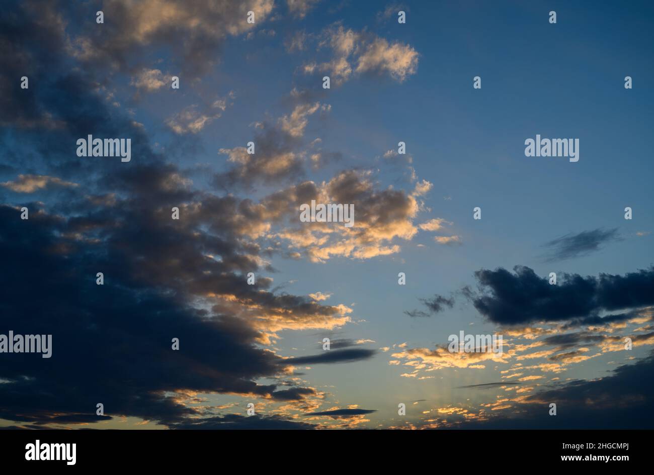 Sunset sky with orange clouds. Nature background Stock Photo - Alamy
