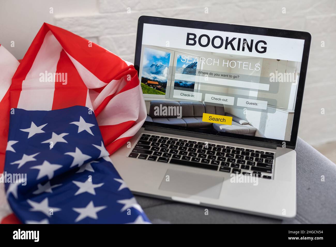 booking on the computer. laptop and american flag Stock Photo - Alamy