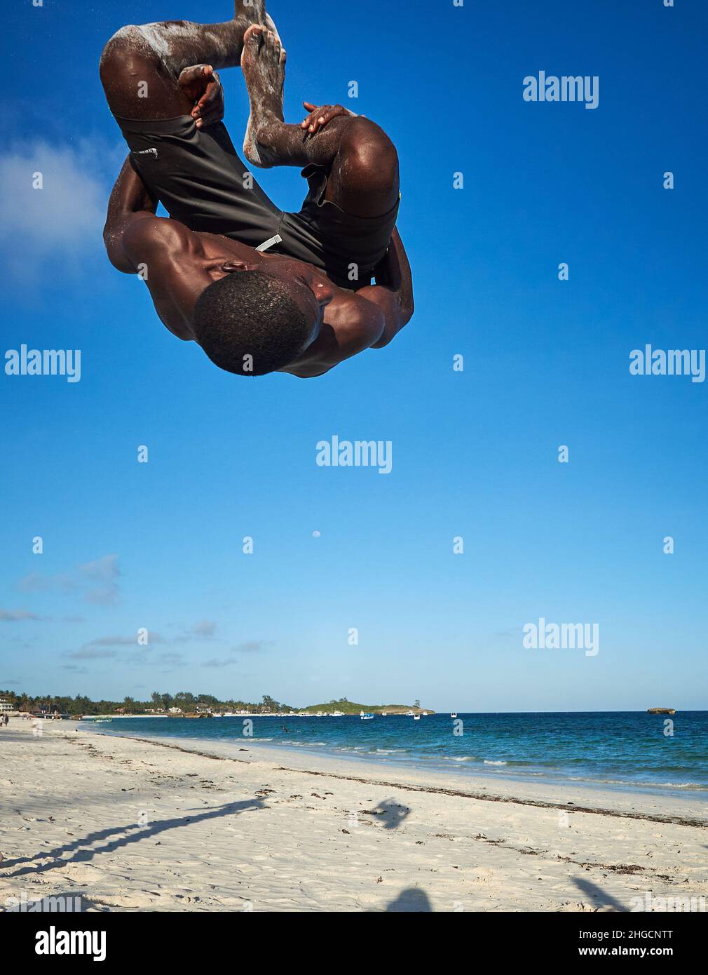 Jumping Rotation Boy performing action acrobatic jump of African young male Aerial ...