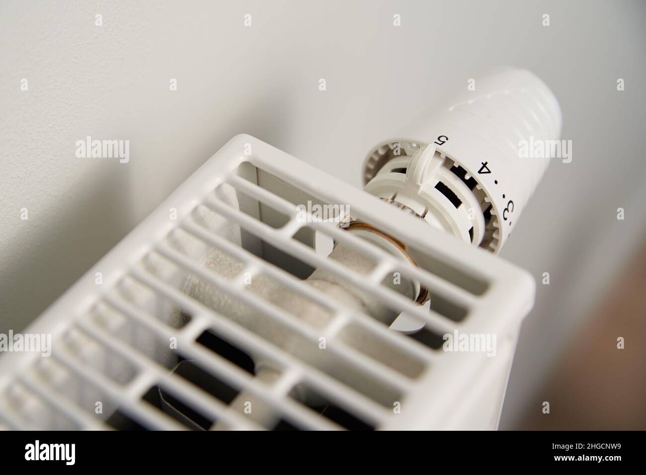 Adjusting temperature on heating radiator thermostat, Turning heat ...