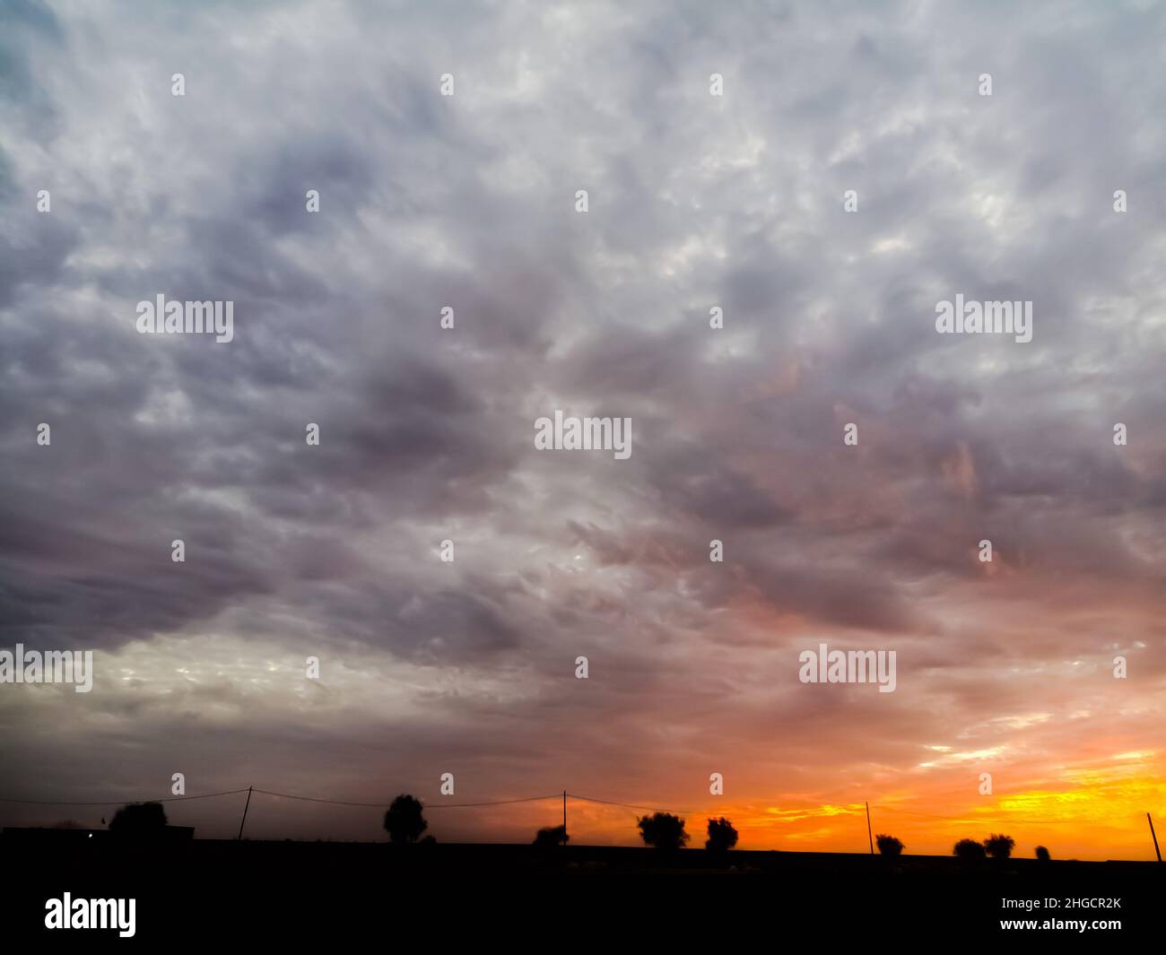 Strom Clouds In The Orange Sky Stock Photo