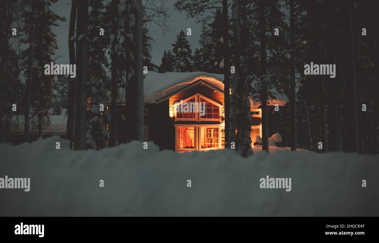 A view of cozy wooden scandinavian cabin cottage chalet house covered ...