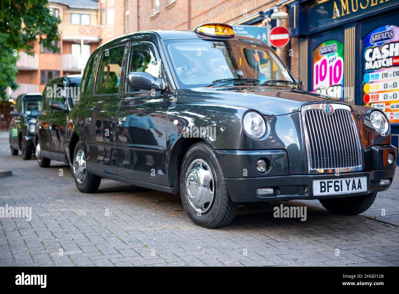 Black cabs for Hackney Carriage Oxford City Council queueing at a taxi rank in Oxford, Oxfordshire, UK Stock Photo