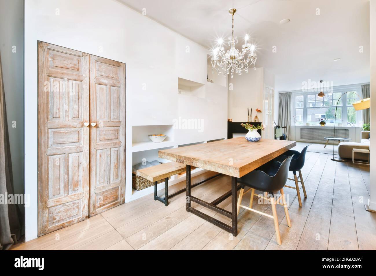 Charming dining room with a solid table and a crystal chandelier Stock ...