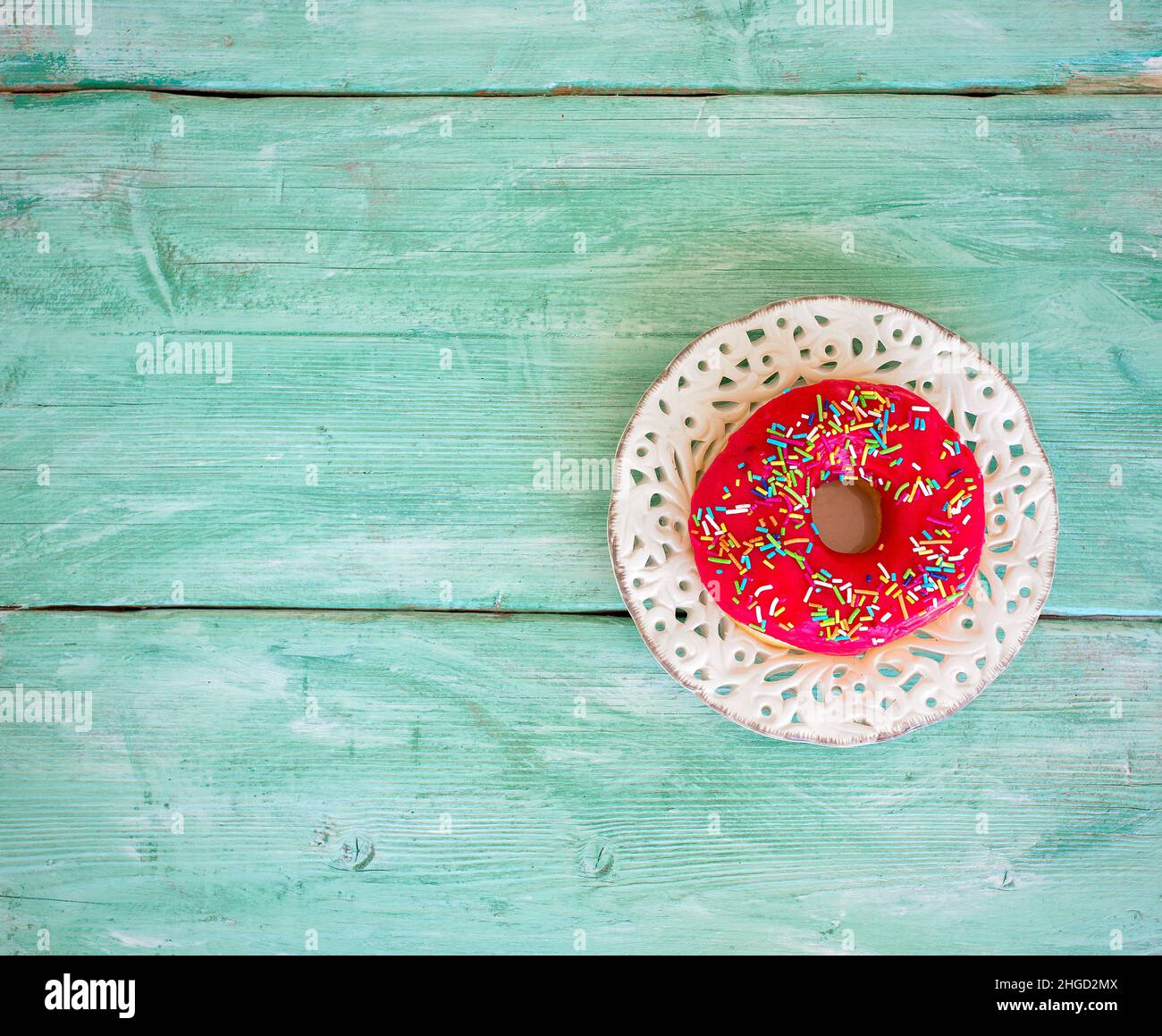 colorful doughnut on wooden surface Stock Photo