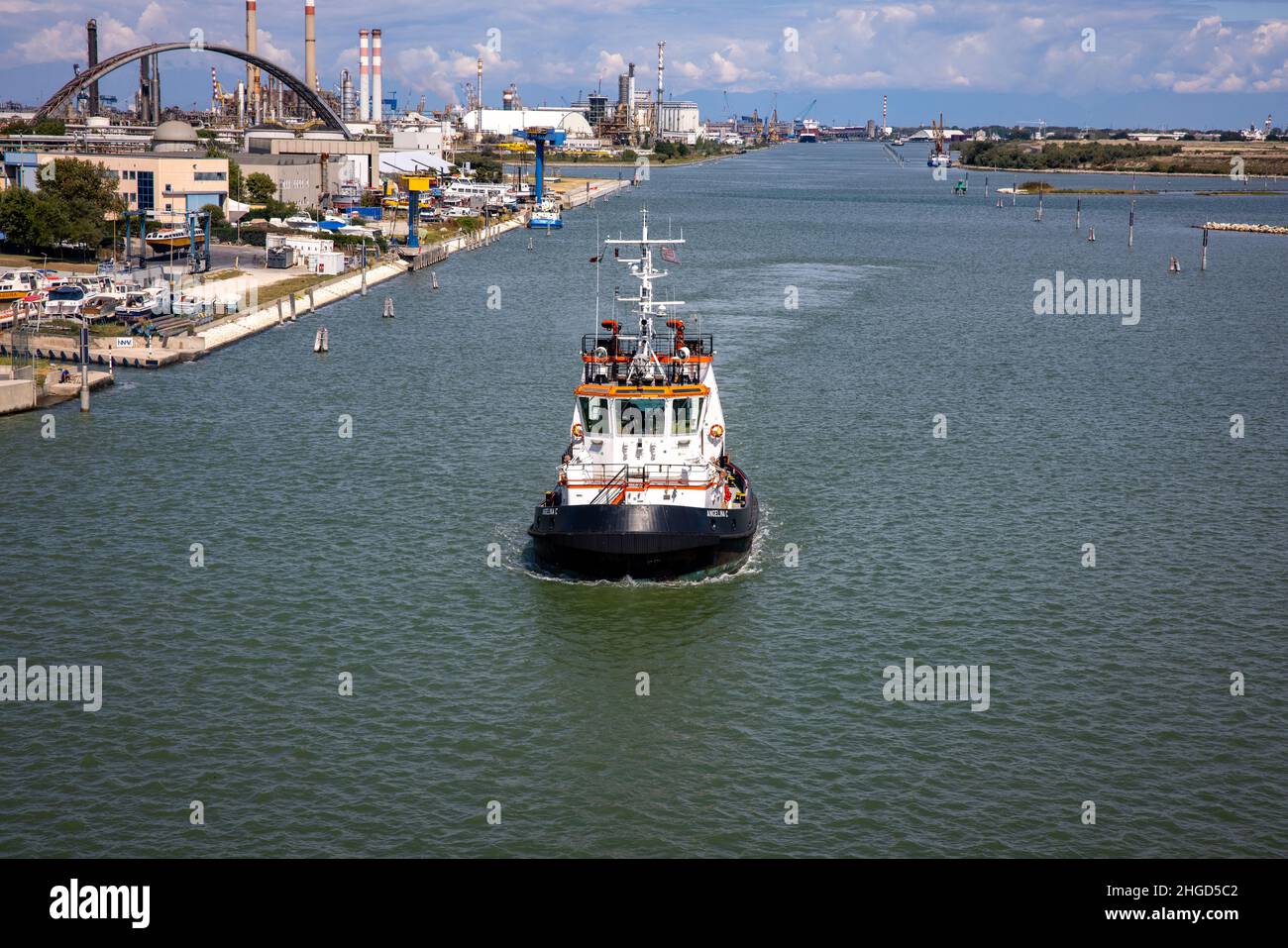 a tugboat behind us, escorted us outside venice Stock Photo