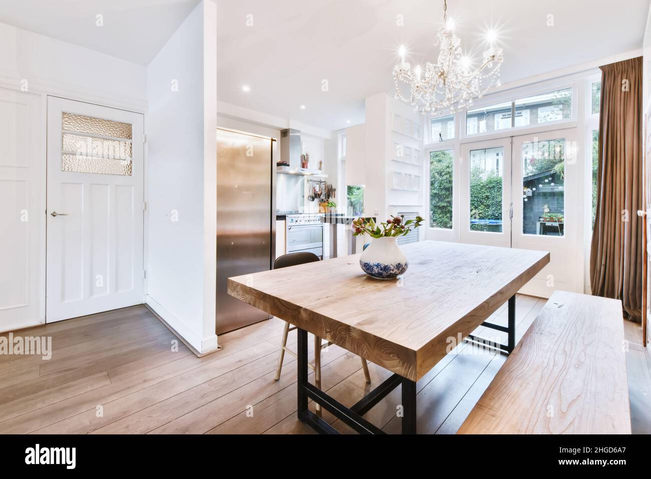 Charming dining room with a solid table and a crystal chandelier Stock ...