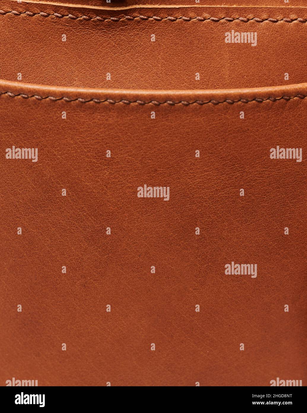 Brown leather background with stitches macro close up view Stock Photo