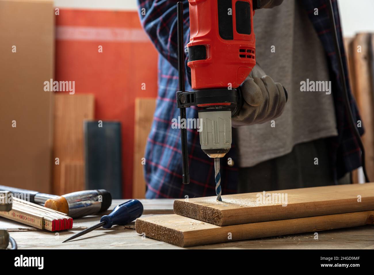 Drill electric tool, hand drilling wood. Construction industry