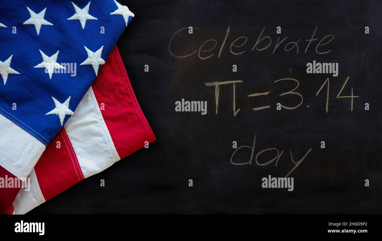 Pi number day, USA. Celebrate Pi text chalk drawing and US flag on a school black board. Stock Photo