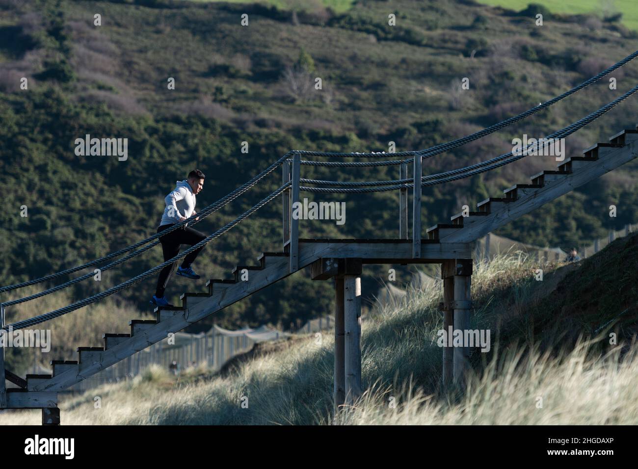 Latin runner training on a stairway. Stock Photo