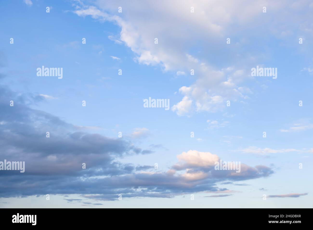 Blue sky with rain clouds in late afternoon. Ideal for a background or template Stock Photo