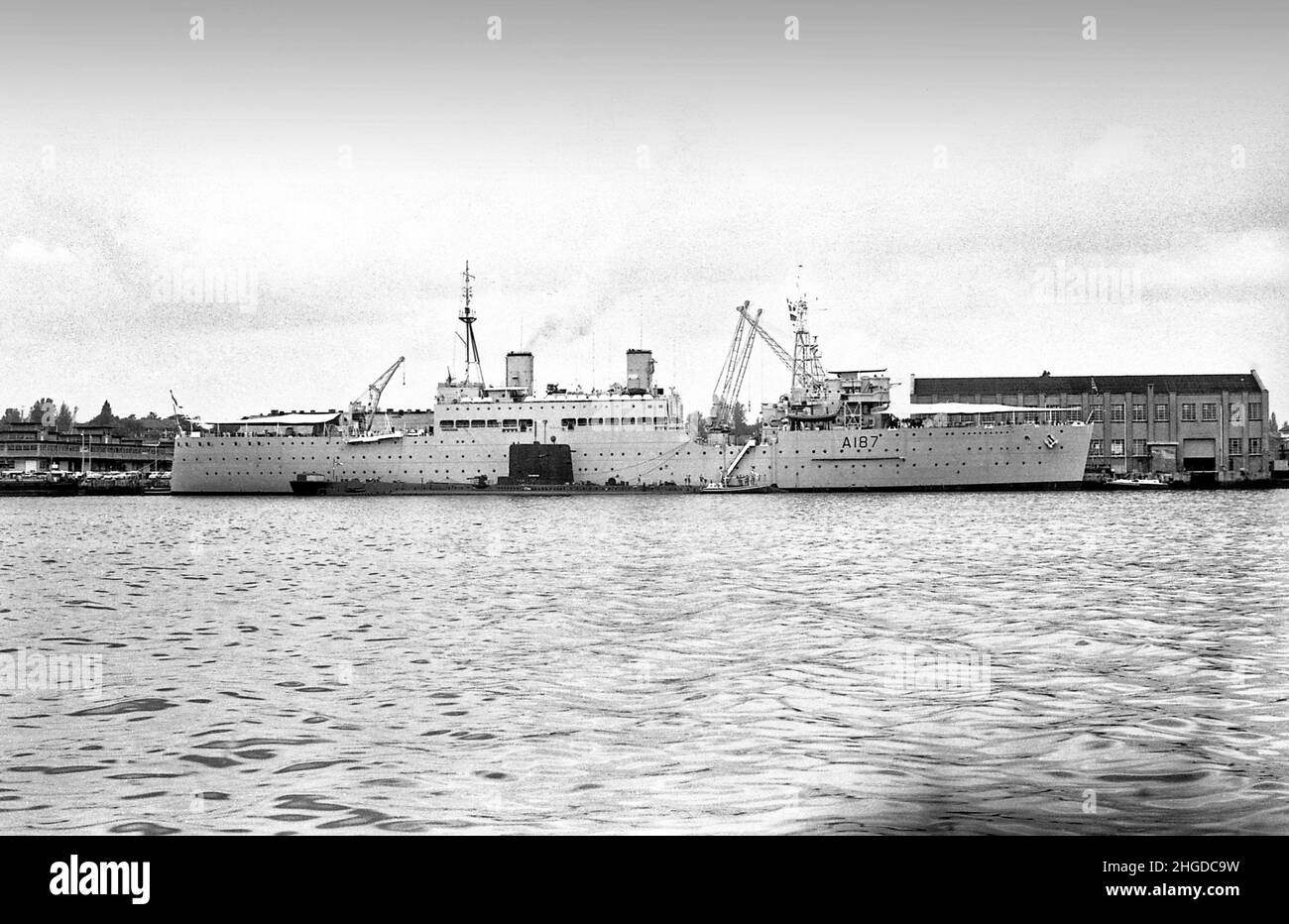 HMS Forth A187 submarine depot ship with an O class submarine replenishing in Singapore 1967 Stock Photo