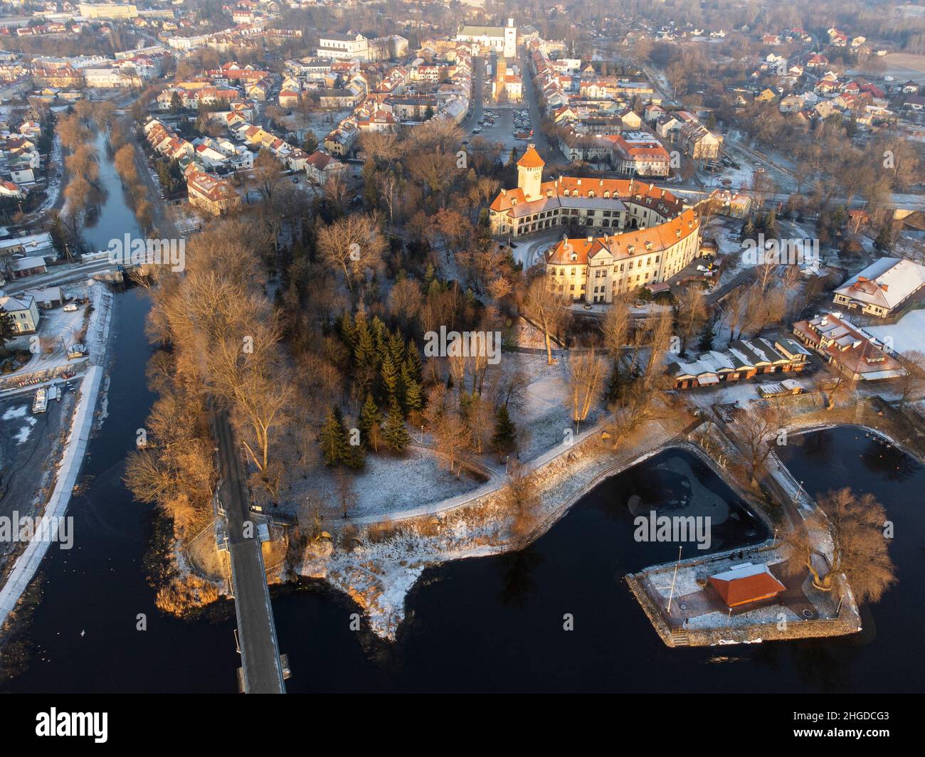 Bridge over the river and town on a calm winter day. Winter. Stock Photo