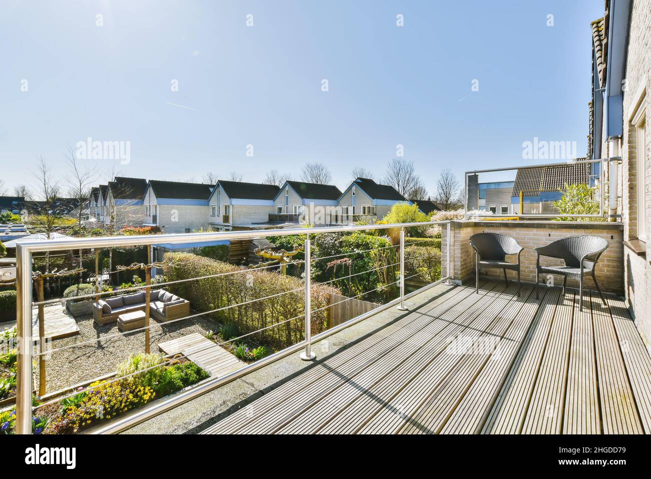 Stunning balcony with wooden floor and two wicker chairs Stock Photo ...