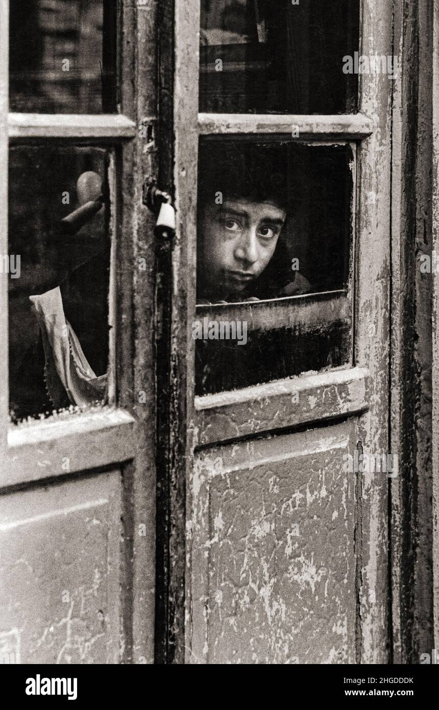 An Arab young man likely Palestinian, looks out of a cafe window in the Old City, Jerusalem, Israel. Circa 1976. Stock Photo