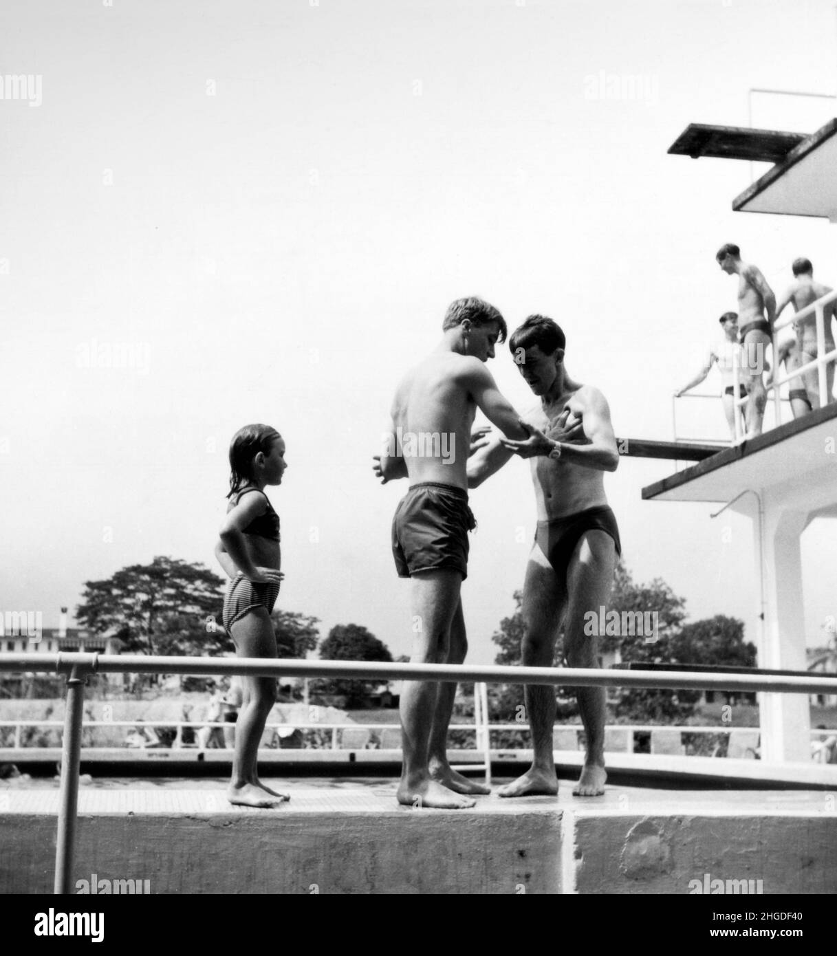 Servicemans life at the weekend in the pool at HMS Simbang Singapore 1967 Stock Photo
