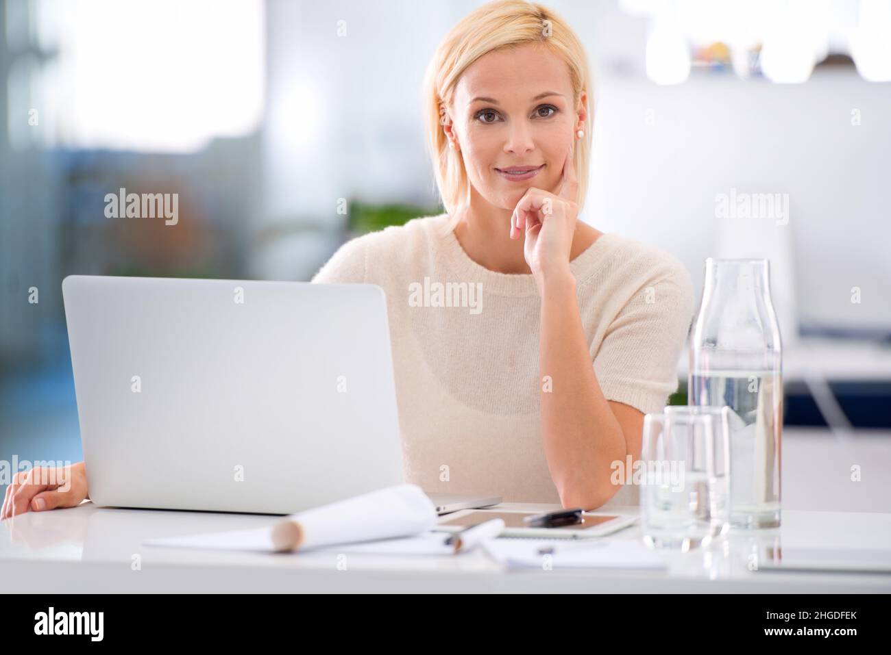 Dreams don't work unless you do. Cropped portrait of an attractive young businesswoman in the office. Stock Photo
