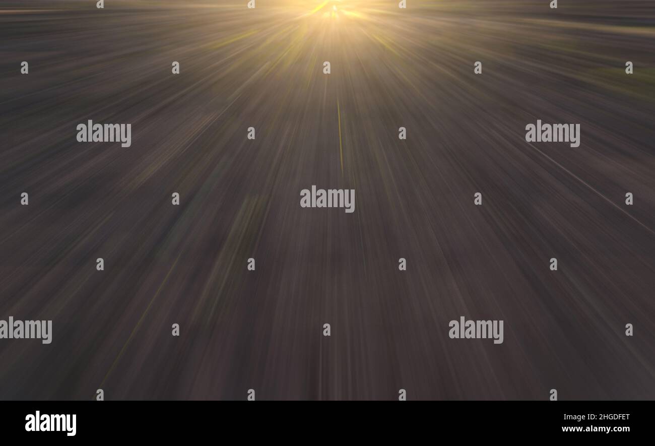 Abstract blurred background. The movement of light rays on a dark background. Stock Photo